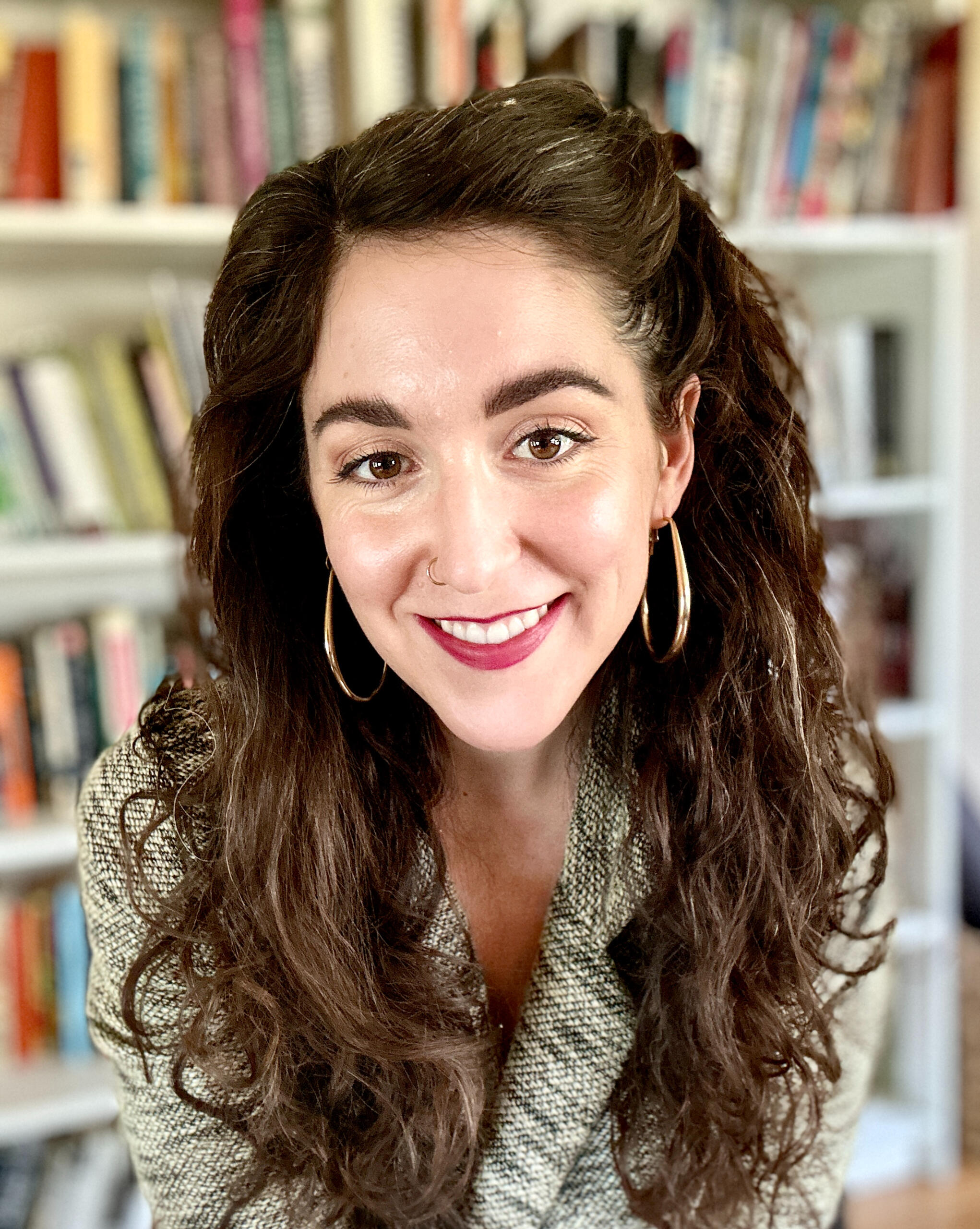 Artemisia Obi Clinical Chinese herbalist sits in her clinic tending to patients